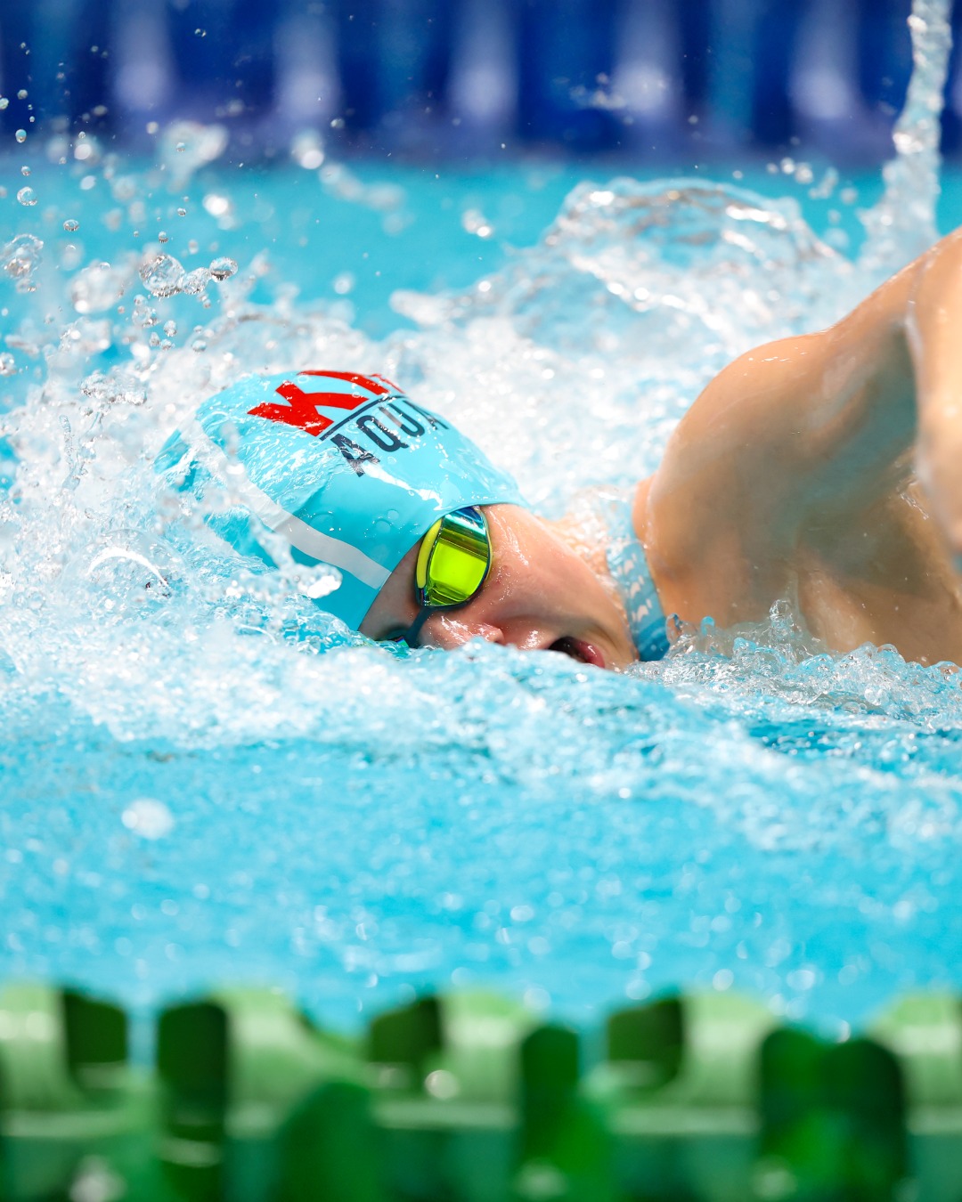 Competitive swimmer powering through the water